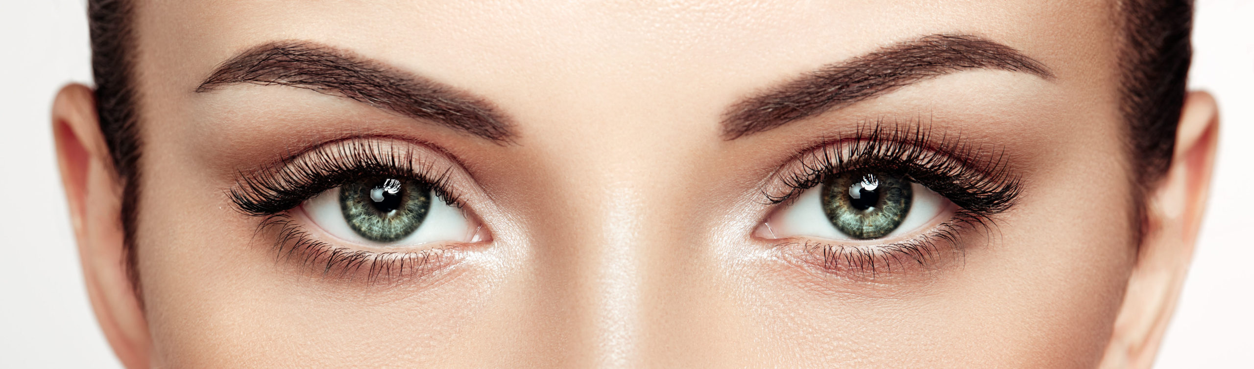 Female Eye with Extreme Long False Eyelashes. Eyelash Extensions. Makeup, Cosmetics, Beauty. Close up, Macro